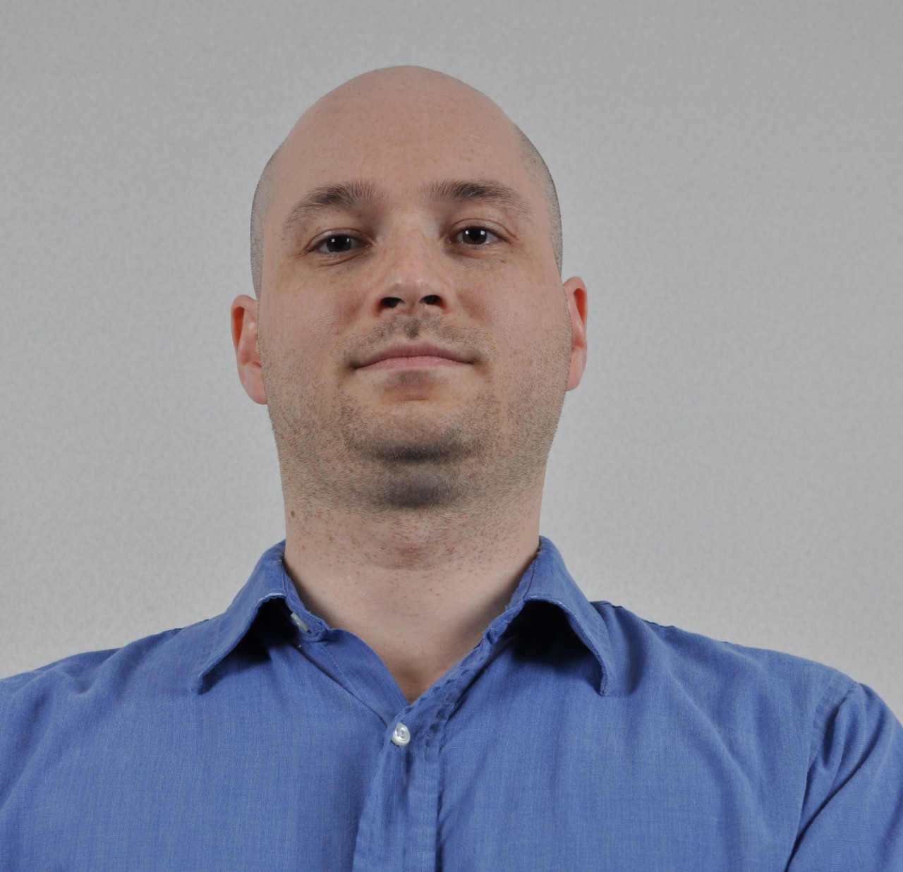 A photo of a man looking down.